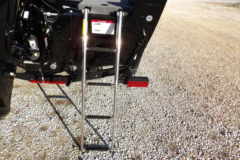 Slide: The Image of 2025 Lund 1775 Adventure SS boat ladder on gravel surface. - 48