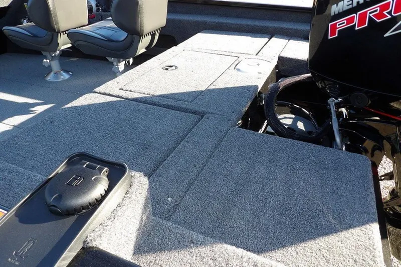 Slide: The Image of 2025 Lund 1775 Adventure SS boat interior with seating and motor details. - 7