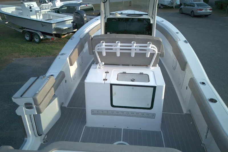 Slide: The Image of 2024 Sea Hunt Gamefish 30 Coffin Box boat interior with seating and storage. - 10