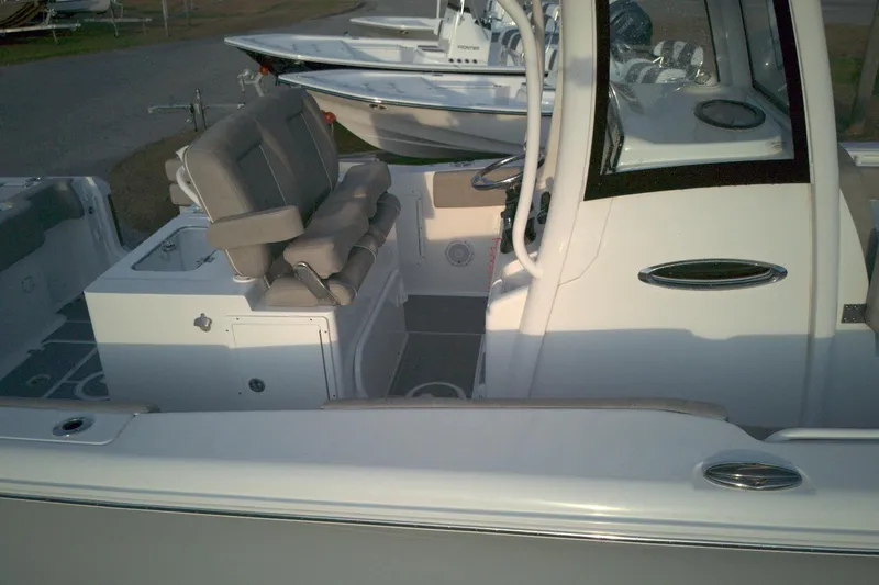 Slide: The Image of 2024 Sea Hunt Gamefish 30 Coffin Box boat interior with seating and console. - 4