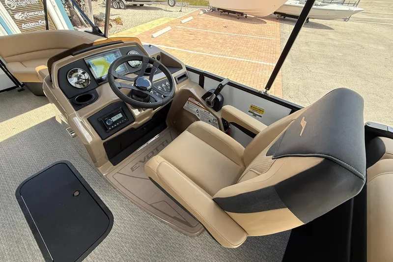 Slide: The Image of 2026 Evotti 523QL boat interior with steering console and luxurious captain's chair. - 10