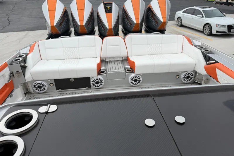 Slide: The Image of 2024 Nor-Tech 500 Sport Center Console with luxurious seating and powerful engines. - 16
