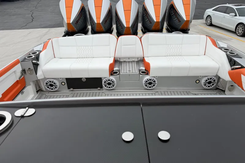 Slide: The Image of 2024 Nor-Tech 500 Sport Center Console with white and orange seating, powerful engines. - 17