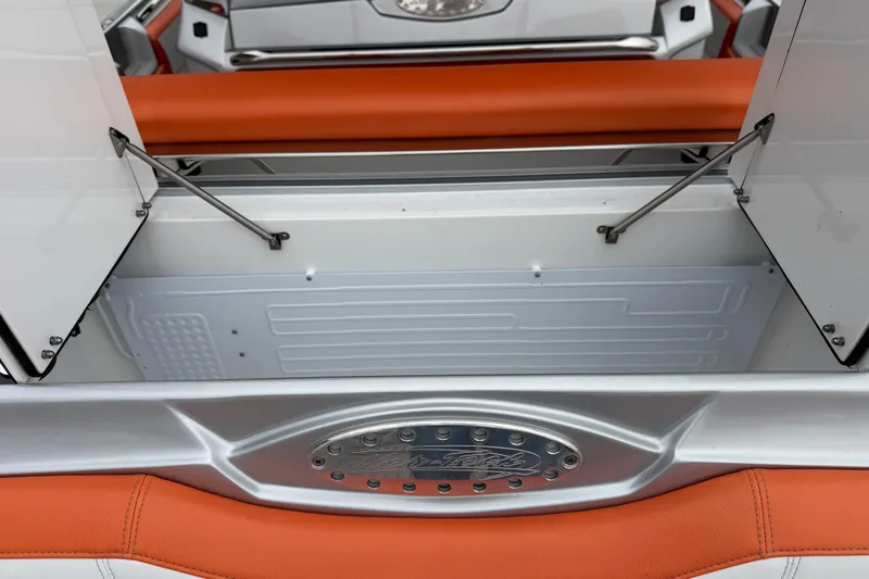 Slide: The Image of 2024 Nor-Tech 500 Sport Center Console with orange seating and open storage compartment. - 18