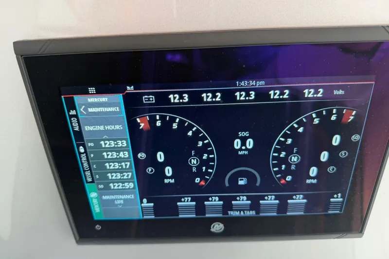 Slide: The Image of Dashboard display of 2024 Nor-Tech 500 Sport Center Console showing engine metrics. - 28