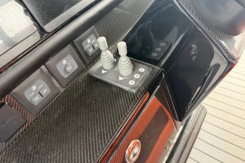 Slide: The Image of Control panel of 2024 Nor-Tech 500 Sport Center Console with joystick and buttons. - 30