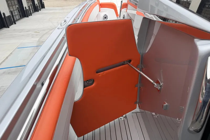 Slide: The Image of 2024 Nor-Tech 500 Sport Center Console with orange interior door detail. - 31