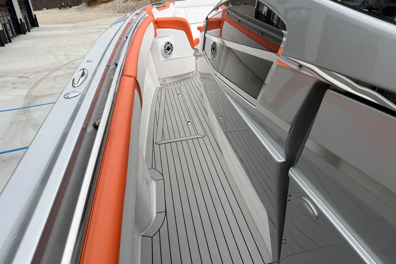 Slide: The Image of 2024 Nor-Tech 500 Sport Center Console with sleek deck and orange accents. - 32