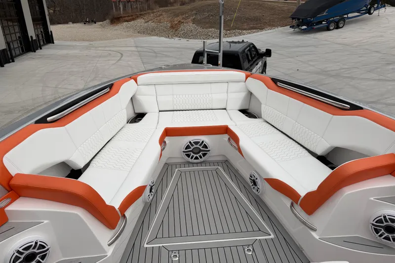 Slide: The Image of 2024 Nor-Tech 500 Sport Center Console with luxurious white and orange seating. - 34