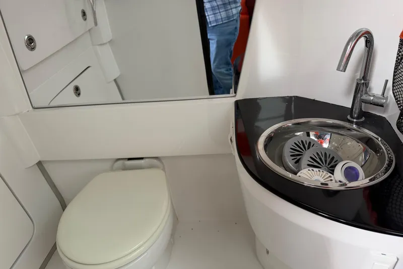 Slide: The Image of 2024 Nor-Tech 500 Sport Center Console bathroom with sink and toilet. - 43