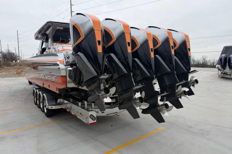 Slide: The Image of 2024 Nor-Tech 500 Sport Center Console with five powerful outboard engines on a trailer. - 6