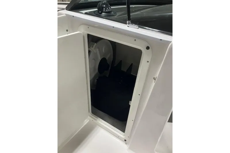 Slide: The Image of 2024 Monterey M-45 boat storage compartment with open door, showcasing interior space. - 10