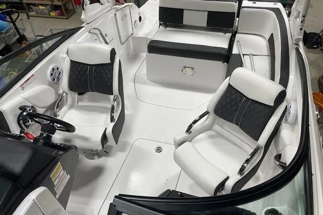 Slide: The Image of 2024 Monterey M-45 boat interior with sleek black and white seating design. - 11