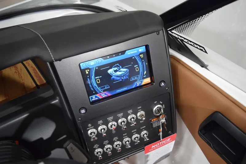Slide: The Image of Dashboard of 2026 Moomba Tykon boat with digital display and control switches. - 10