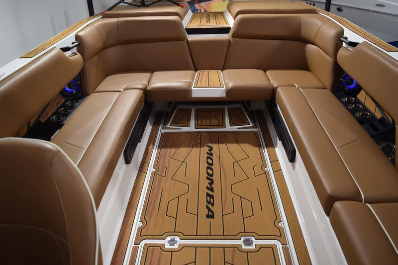 Slide: The Image of Luxurious interior of 2026 Moomba Tykon boat with brown leather seating and stylish flooring. - 12