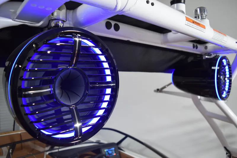 Slide: The Image of LED-lit speakers on a 2026 Moomba Tykon boat, mounted on a white frame. - 20