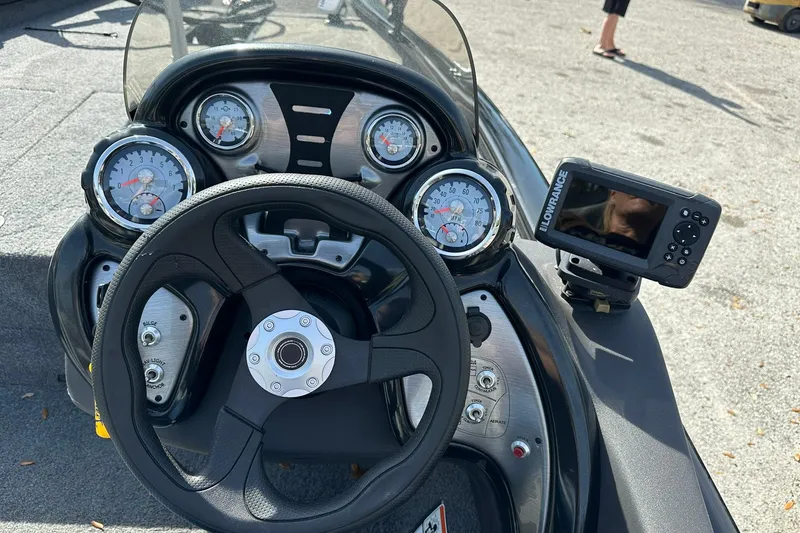 Slide: The Image of 2018 Tracker Pro Team 175 TXW boat dashboard with gauges and Lowrance fishfinder. - 11