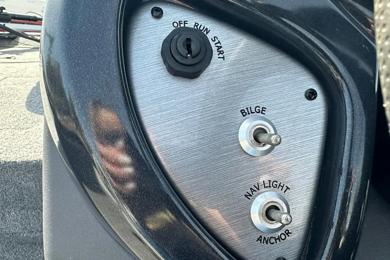 Slide: The Image of Control panel of a 2018 Tracker Pro Team 175 TXW boat with switches and ignition. - 15