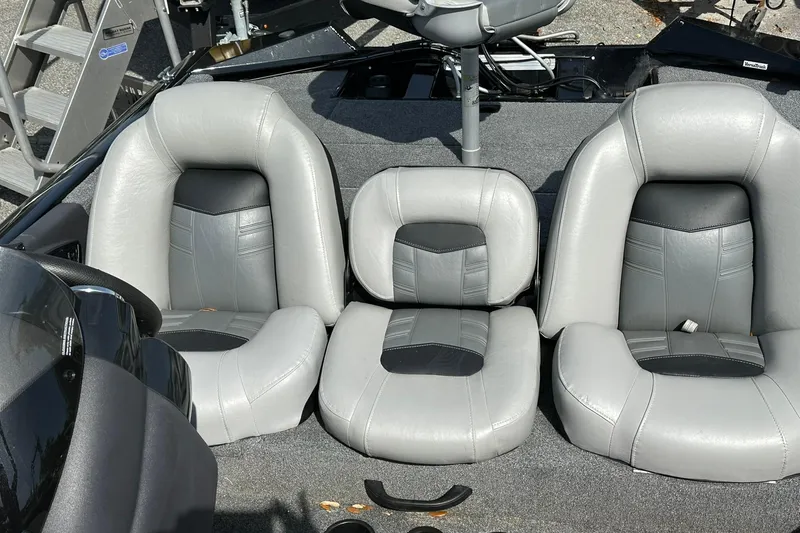 Slide: The Image of 2018 Tracker Pro Team 175 TXW boat seats, gray and black upholstery, interior view. - 16