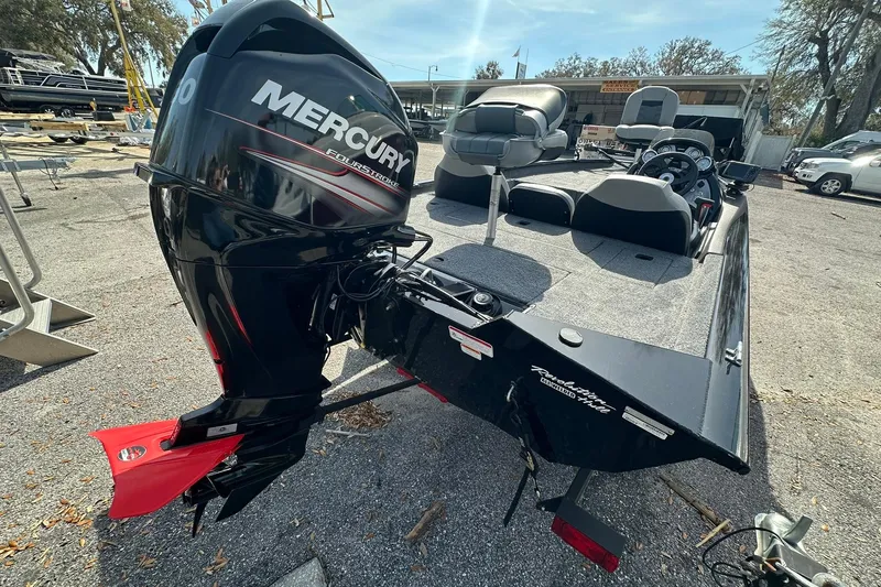 Slide: The Image of 2018 Tracker Pro Team 175 TXW boat with Mercury FourStroke engine, parked outdoors. - 22