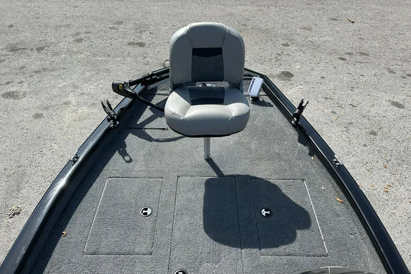 Slide: The Image of 2018 Tracker Pro Team 175 TXW boat with gray seating and carpeted deck. - 8
