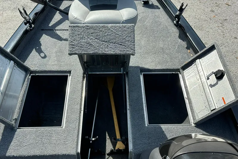 Slide: The Image of 2018 Tracker Pro Team 175 TXW boat interior with open storage compartments. - 9