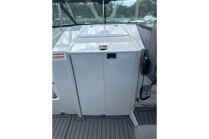 Slide: The Image of 2019 Cruisers Yachts 338 Outboard, sleek white deck with glass railing, overcast sky. - 16