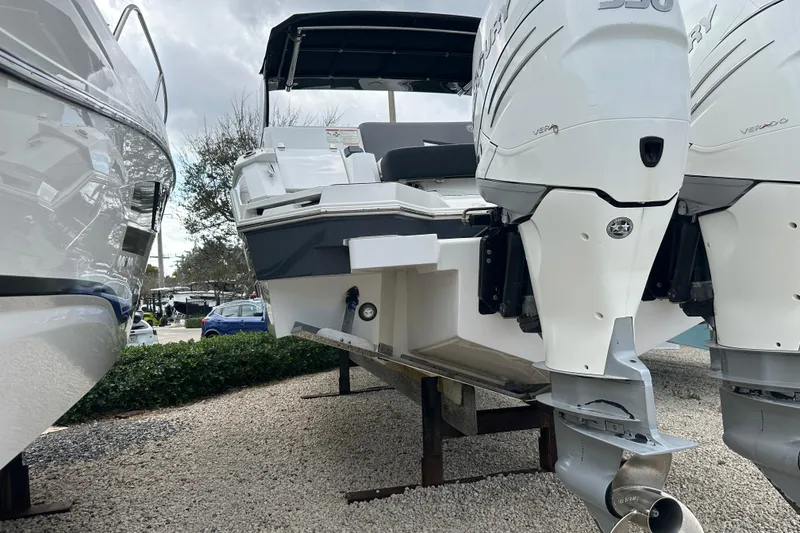 Slide: The Image of 2019 Cruisers Yachts 338 Outboard interior with microwave and window view. - 28