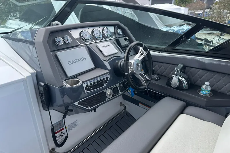 Slide: The Image of 2019 Cruisers Yachts 338 Outboard boat interior with seating and dual engines. - 6