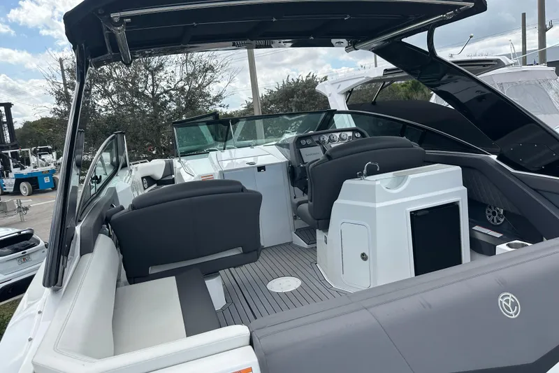 Slide: The Image of 2019 Cruisers Yachts 338 Outboard interior with seating and helm, showcasing luxury design. - 5