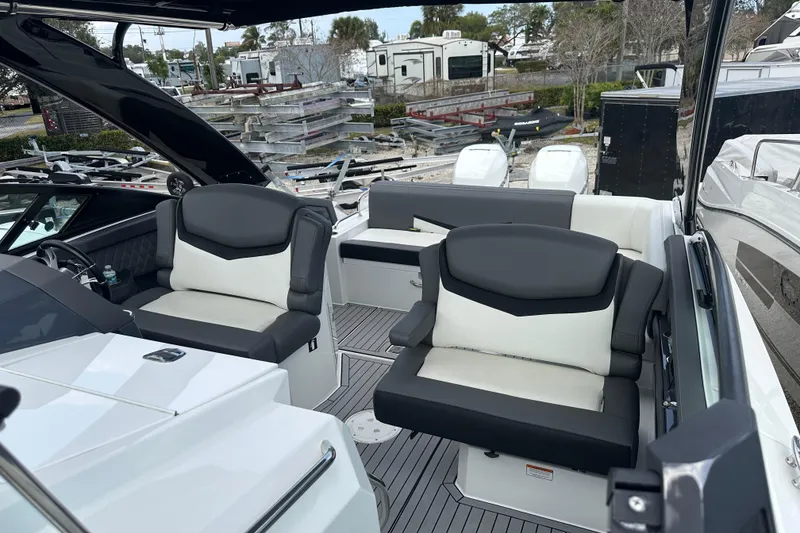 Slide: The Image of 2019 Cruisers Yachts 338 Outboard interior with sleek seating and modern design. - 8
