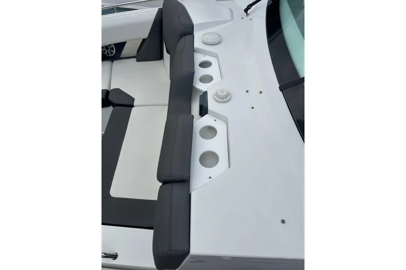 Slide: The Image of 2019 Cruisers Yachts 338 Outboard interior with cushioned seating and cup holders. - 9