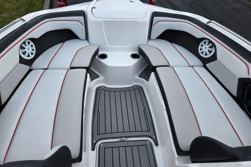 Slide: The Image of 2018 Yamaha Boats 212X interior with sleek seating and modern design. - 17