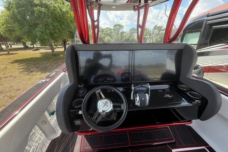 Slide: The Image of Cockpit of 2018 Statement 380 Open boat with modern steering and dual screens. - 12