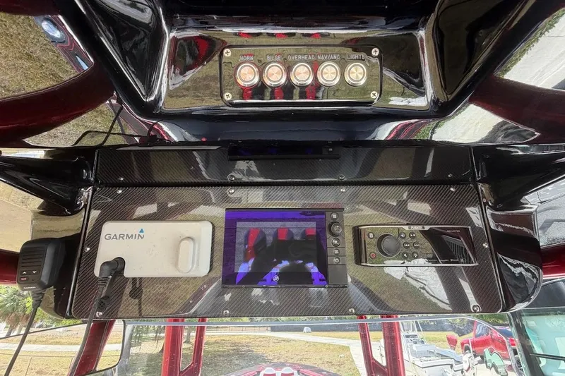 Slide: The Image of Control panel of a 2018 Statement 380 Open boat with Garmin navigation system. - 22