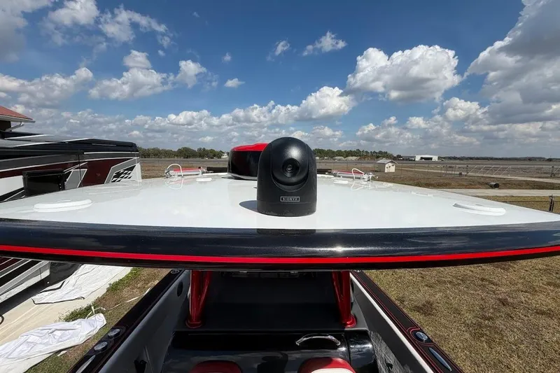 Slide: The Image of 2018 Statement 380 Open boat with camera on deck under a cloudy sky. - 24