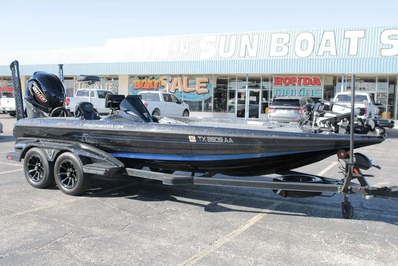 The Image of 2025 Skeeter FXR21 Limited boat on trailer outside dealership. - 0