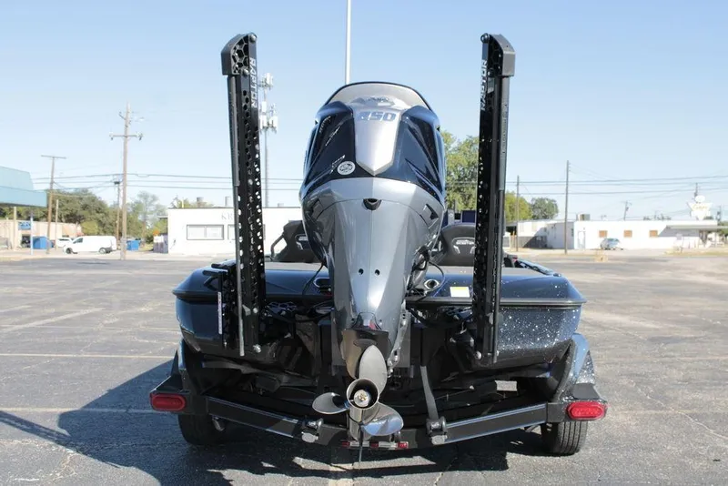 Slide: The Image of 2025 Skeeter FXR21 Limited boat rear view with powerful outboard motor. - 13