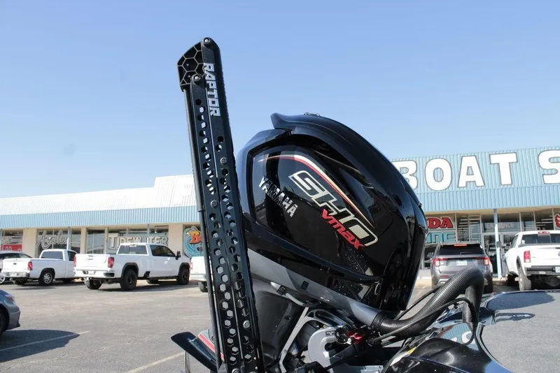 Slide: The Image of 2025 Skeeter FXR21 Limited with Yamaha VMAX engine at a boat dealership. - 15