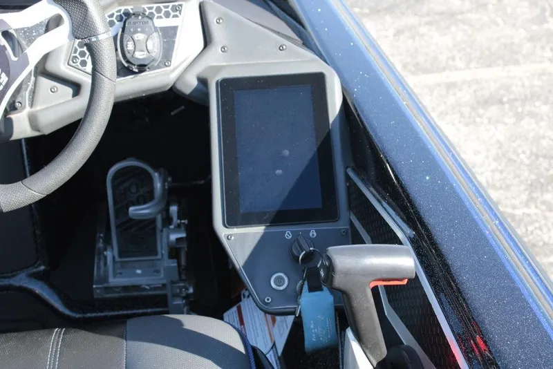 Slide: The Image of 2025 Skeeter FXR21 Limited boat dashboard with touchscreen and steering wheel. - 9