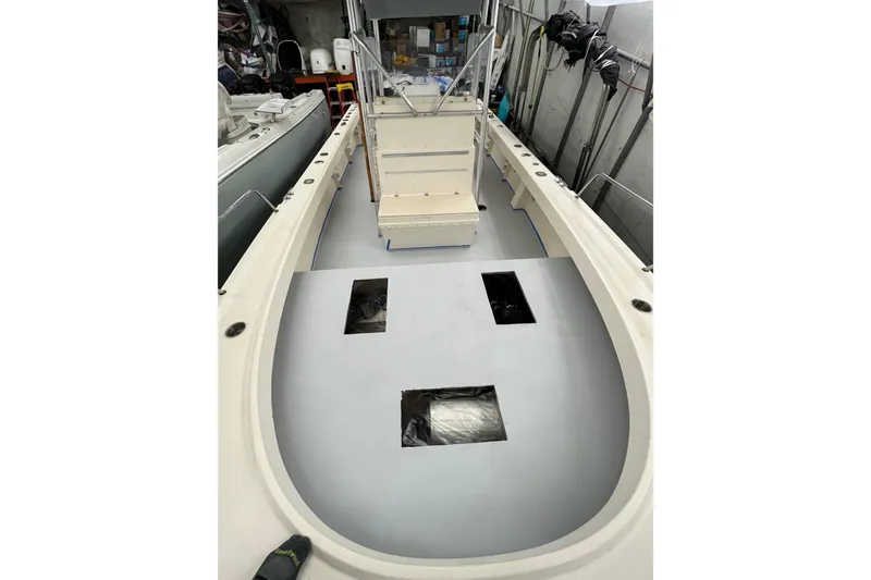 Slide: The Image of 2003 Parker 2500 Special Edition boat interior with open deck and storage compartments. - 2