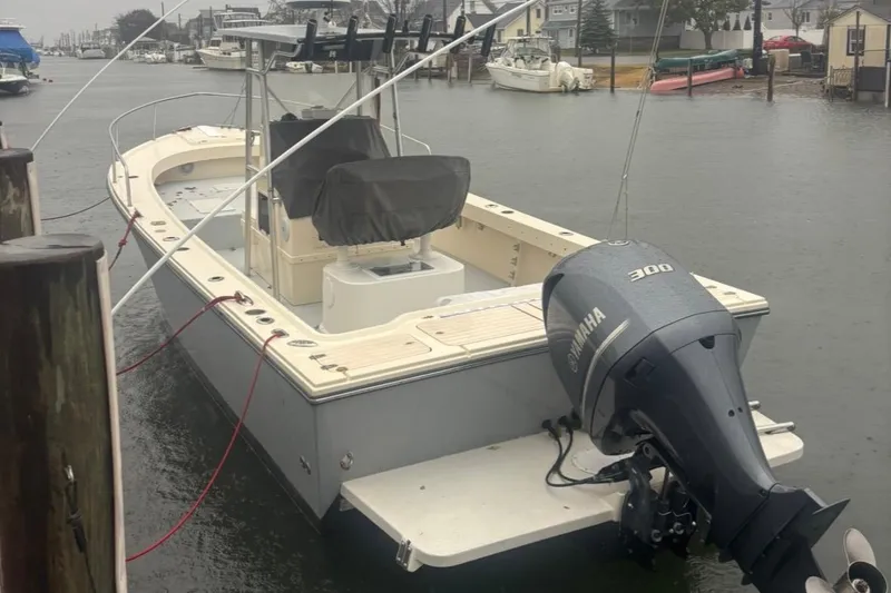 Slide: The Image of 2003 Parker 2500 Special Edition boat docked, featuring a Yamaha 300 outboard motor. - 3