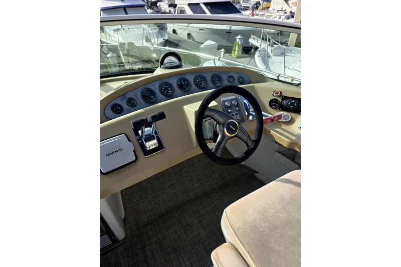 Slide: The Image of Helm of 2001 Carver 350 Mariner with Garmin navigation system and steering wheel. - 9