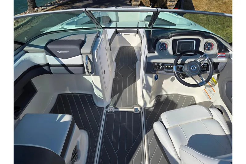 Slide: The Image of 2018 Chaparral Vortex 223 VR boat interior with modern dashboard and seating. - 11