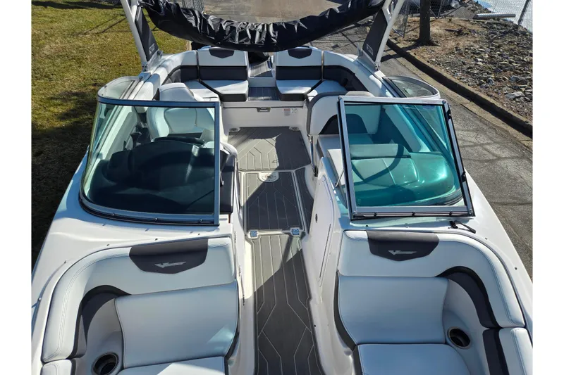Slide: The Image of 2018 Chaparral Vortex 223 VR boat interior with open windshield and seating. - 21