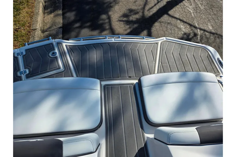 Slide: The Image of 2018 Chaparral Vortex 223 VR boat deck with cushioned seating and textured flooring. - 25