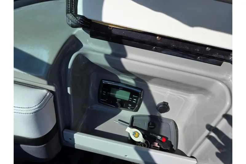 Slide: The Image of 2018 Chaparral Vortex 223 VR boat dashboard with stereo and keys. - 26