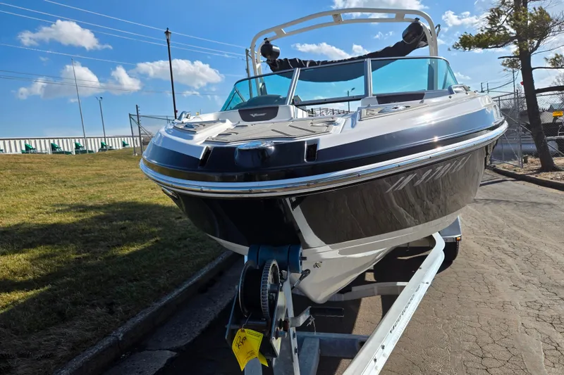 Slide: The Image of 2018 Chaparral Vortex 223 VR boat on trailer under blue sky. - 6