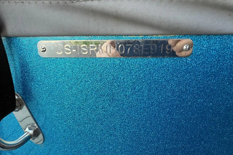 Slide: The Image of 2019 Moomba Helix boat with metallic blue finish and visible hull identification number. - 9