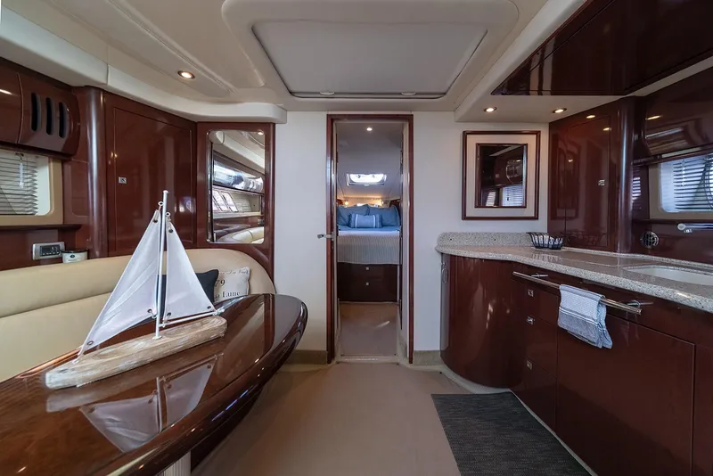 Slide: The Image of Luxurious interior of 2008 Sea Ray 440 Sundancer yacht with elegant wood finishes. - 14